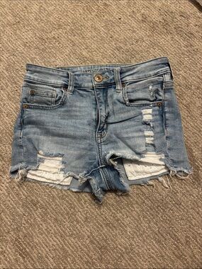 American Eagle High-Rise Distressed Light Blue Denim Shorts with lace pockets